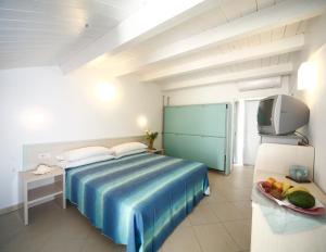 Ένα ή περισσότερα κρεβάτια σε δωμάτιο στο Hotel Lara
