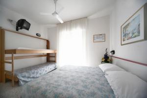 Ένα ή περισσότερα κρεβάτια σε δωμάτιο στο Hotel Lara