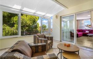 a living room with two couches and a table at 4 Bedroom Amazing Home In Zaboric in Zaboric