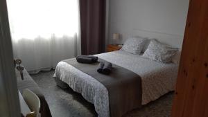 Postel nebo postele na pokoji v ubytování BNB LOLA - Habitacion privada - Aire acondicionado - Baños compartidos