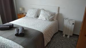 Postel nebo postele na pokoji v ubytování BNB LOLA - Habitacion privada - Aire acondicionado - Baños compartidos