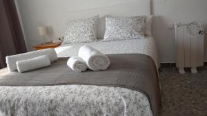Postel nebo postele na pokoji v ubytování BNB LOLA - Habitacion privada - Aire acondicionado - Baños compartidos