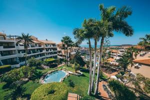 an aerial view of a resort with palm trees and a pool at Mandarina 119 in San Miguel de Abona