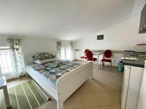 Postel nebo postele na pokoji v ubytování Apartmani TOMINAC