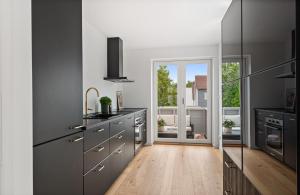 Kuchyň nebo kuchyňský kout v ubytování Koselig sentral leilighet