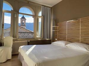 Voodi või voodid majutusasutuse Albergo Commercio - Ristorante Mas-cì toas