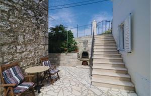 a patio with a table and chairs and stairs at Holiday Home Potok Vi in Trsteno +34 photos
