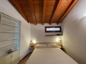 Voodi või voodid majutusasutuse Albergo Commercio - Ristorante Mas-cì toas