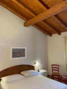 Voodi või voodid majutusasutuse Albergo Commercio - Ristorante Mas-cì toas