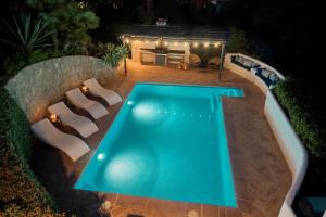 an overhead view of a swimming pool at night at Villa Tosalet Pomelo in Jávea