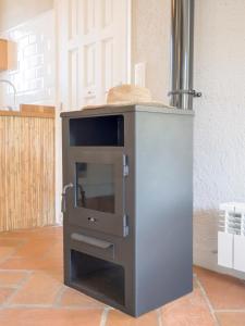a kitchen with a counter with a stove at Villa Tosalet Pomelo in Jávea