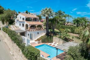 an aerial view of a house with a swimming pool at Villa Tosalet Pomelo in Jávea