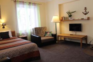 TV a/nebo společenská místnost v ubytování Hotel Senlīči + 37 fotografií