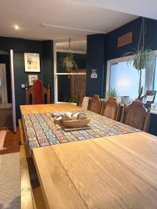 a wooden table with a pair of shoes on top at The Boho - 4 min walk to beach & town in Bournemouth
