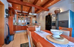 a kitchen with a table with a bowl on it at Cozy Home In Cakovec With Sauna in Čakovec