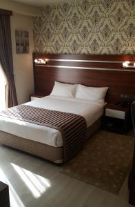 Кровать или кровати в номере My Liva Hotel