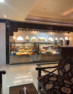 a kitchen with a refrigerator filled with lots of food at مسكن لؤلؤة الخليج للشقق المخدومة in Dammam