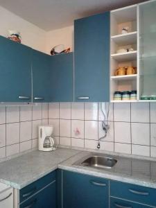Kuchyňa alebo kuchynka v ubytovaní Apartments Soni