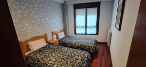 Łóżko lub łóżka w pokoju w obiekcie A Bruxo Fonte 8 pzs 2 baños Full Reg VUT38509