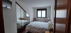 Łóżko lub łóżka w pokoju w obiekcie A Bruxo Fonte 8 pzs 2 baños Full Reg VUT38509