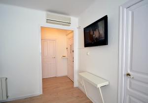 Televisyen dan/atau pusat hiburan di Sunny Apartment Central Sitges