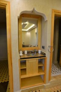 a bathroom with a sink and a mirror at Tirazir House 3 in Mirleft