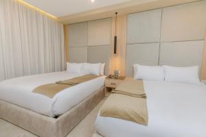 Postel nebo postele na pokoji v ubytování Tiye Pyramids Hotel