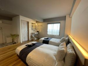 Кровать или кровати в номере Fukuyama Royal Hotel - Vacation STAY 36230v