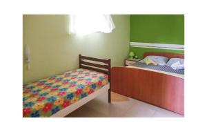 a bedroom with two beds and a bedskirts at 1 Bedroom Beautiful Apartment In Vrbnik in Vrbnik