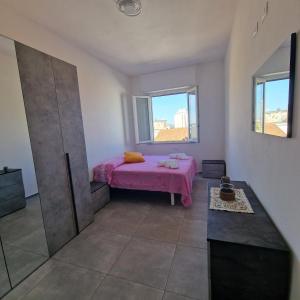 Ένα ή περισσότερα κρεβάτια σε δωμάτιο στο Al Mare da Paola +6 φωτογραφίες