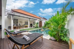an image of a villa with a swimming pool at Brand New 4BDR Villa - Cozy and Stylish - CANGGU with Breathtaking Stunning View in Seminyak