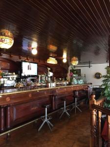 Zona de lounge sau bar la Hostal El Carro