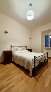 Ένα ή περισσότερα κρεβάτια σε δωμάτιο στο Casa del Conte