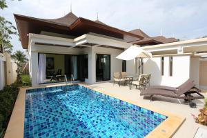 a swimming pool in the backyard of a villa at Baan Ping Tara Private Pool Villa in Ao Nang Beach
