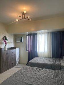 Giường trong phòng chung tại Affordable Tagaytay Serin East Staycation +15 ảnh