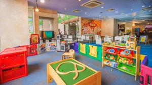 a childrens play room with toys and a tv at Hotel Ocean (Kokusai-Dori) in Naha