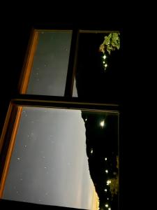 a close up of two windows with lights at Hilltop hideaway in Kandogal