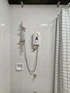 a shower in a bathroom with a shower at Family Apartment By The Beach with Kitchen Netflix Station 3 Beachfront in Boracay