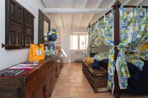 a bedroom with a bed with a dresser and a desk at 2 Bedrooms central Saint-Tropez, next to the Port in Saint-Tropez