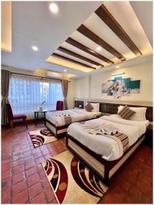 Postel nebo postele na pokoji v ubytování Satkar Boutique Home + 37 fotografií