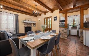 a dining room and living room with a table and chairs at Gorgeous Home In Pazin With Kitchen in Pazin