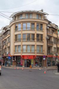 a large building on the corner of a street at Apartment Lermontov in Burgas +7 photos