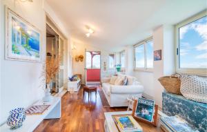 a living room with a couch and a table at Stunning Home In Montalto Di Castro in Montalto di Castro