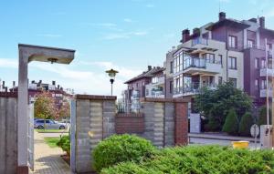 a row of houses on a street in a city at 1 Bedroom Cozy Home In Kolobrzeg in Kołobrzeg