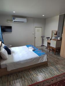 Postel nebo postele na pokoji v ubytování Lalisa Hotel Aonang