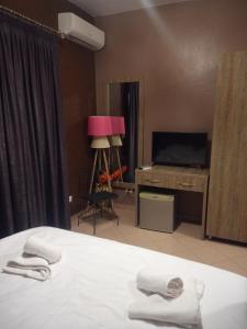 Letto o letti in una camera di Prince Hotel Fier