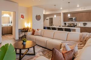 a living room with a couch and a kitchen at Capital Views 2BR 2BA Pool,Gym,Convention Centre in Salt Lake City +36 photos