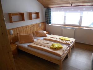 Postel nebo postele na pokoji v ubytování Penzion Kamzík