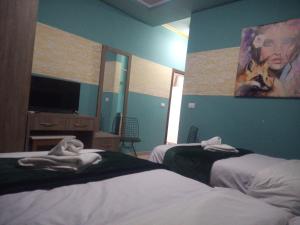 Letto o letti in una camera di Prince Hotel Fier