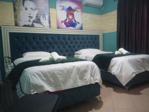 Letto o letti in una camera di Prince Hotel Fier